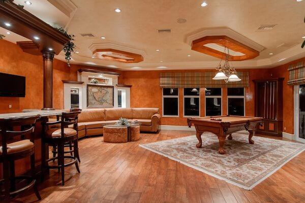 Create a floating whiskey shelf, hang a rustic photo, add a dart board - the options are endless for your mancave