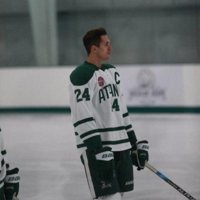 Hunter enjoys playing hockey with his friends