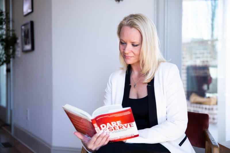 lady reading a book for professional growth purposes