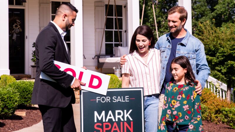 Family with little girl in a flower shirt selling their home through Mark Spain Real Estate's Guaranteed Offer program.